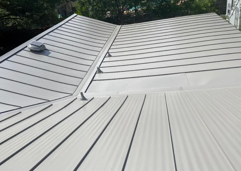 Solar attic fan installed on a metal roof for Roof Ventilation in Killeen